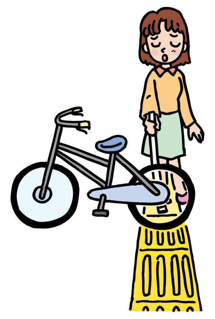 イラスト：点字ブロックを歩く女性の前に自転車が置かれている